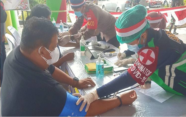 mass vaccination holds central kalimantan regional police collaborate with dayak customary council dad 41340